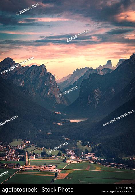 View of Dobbiaco Lake and surrounding mountains. Dolomites, Italy in summer