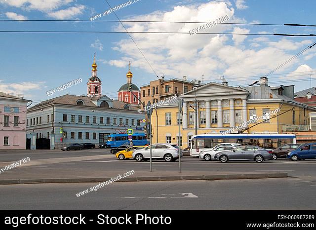 RUSSIA, MOSCOW - MAY 11, 2016: View of the Yauzskaya street with beautiful architecture and a part of the Peter and Paul Church