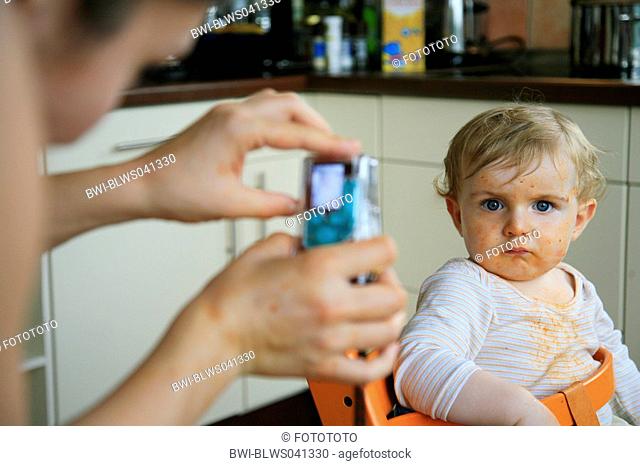 small boy with dirty face getting shoot