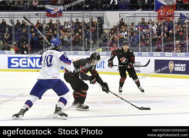 L-R Samuel Knazko (SVK), Joe Veleno and Bowen Byram (both CAN) in action during the 2020 IIHF World Junior Ice Hockey Championships quarterfinal match between...