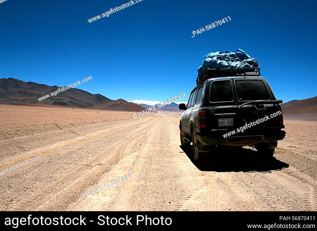 An off-road vehicle stands on October 15, 2009 on a runway in the Altiplano of the Andes on the way from San Pedro de Atacama (Chile) to Uyuni, Bolivia