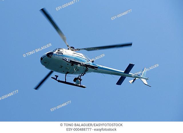 Helicopter holding video camera filming