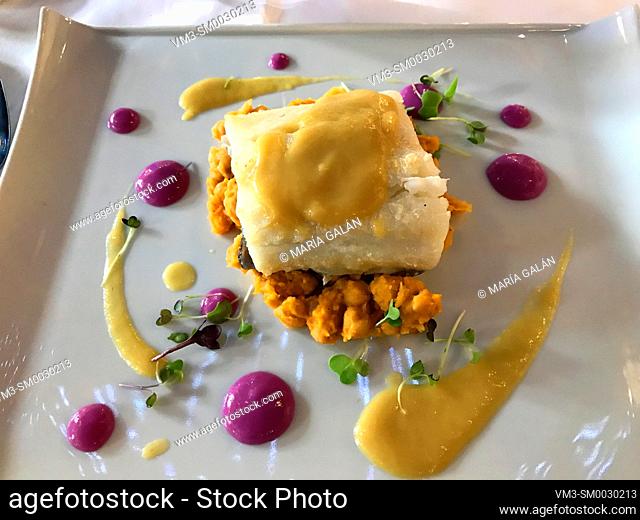 Grilled cod loin with chickpeas and cabbage sauce. Spain