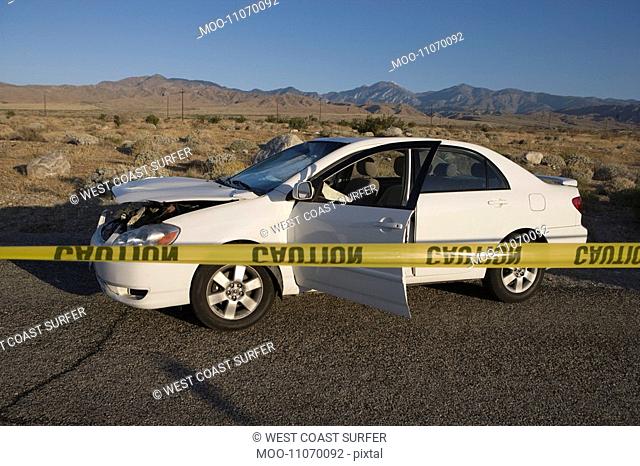 Damaged car in desert