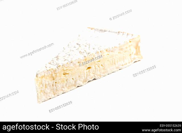 Brie cheese. White soft cheese with white mold isolated on white background