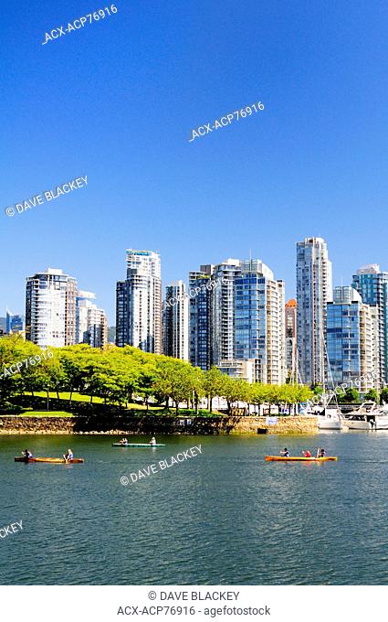 People canoeing near Ron Basford Park in False Creek in Vancouver, BC