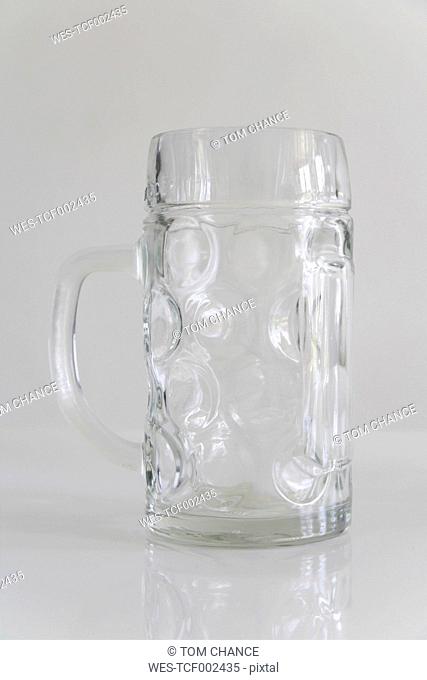 Empty beer mug on white background, close up