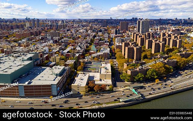 Aerial view over the far north on Manhattan Island in and around Harlem NY