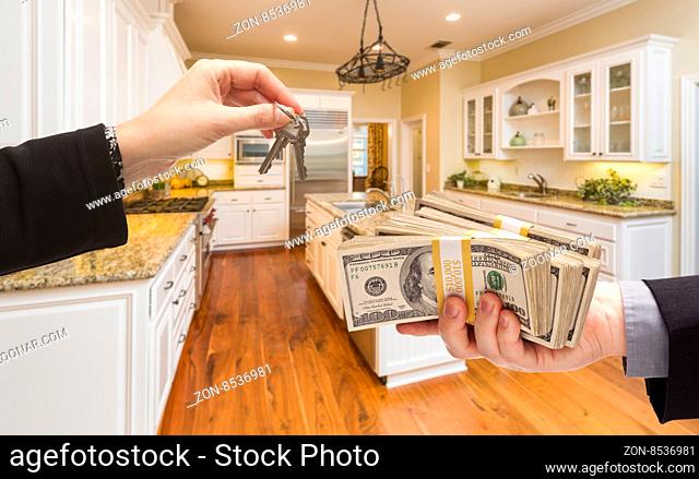 Handing Over Keys for Cash In Beautiful Custom Kitchen Interior