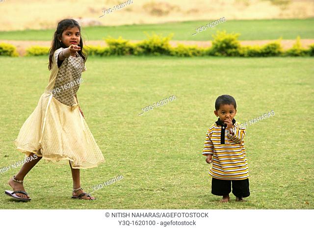 Young boy and sister in Hampi, a world heritage site in India