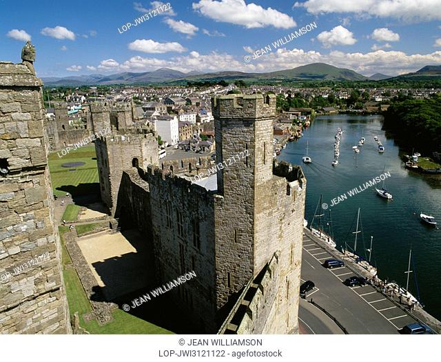 Looking SE from the Eagle Tower of Caernarfon Castle over the Queen's Tower, Slate Quay and the River Afon Seiont towards Moel Eilio and other peaks of...