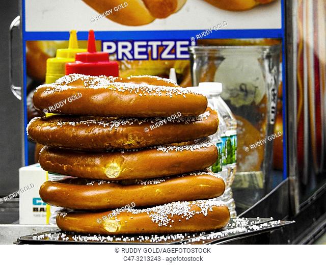 Pretzel. A type of baked bread product made from dough most commonly shaped into a twisted knot. Pretzels originated in Europe