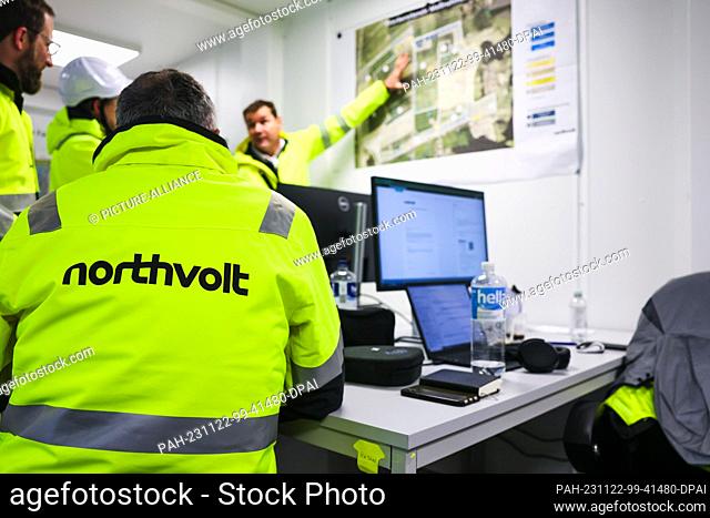 22 November 2023, Lower Saxony, Heide: Northvolt employees talk in a planning office on a construction site in the Dithmarschen district