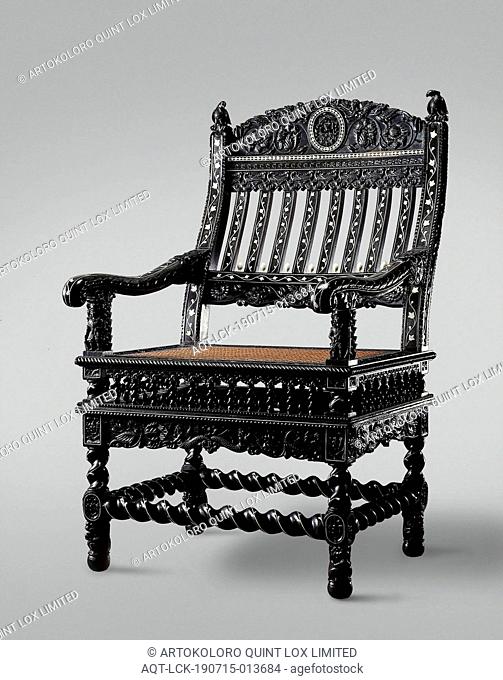Armchair of ebony, inlaid with ivory and decorated with Nereids, flowers and birds, armrests are propped up by a figure of a European soldier