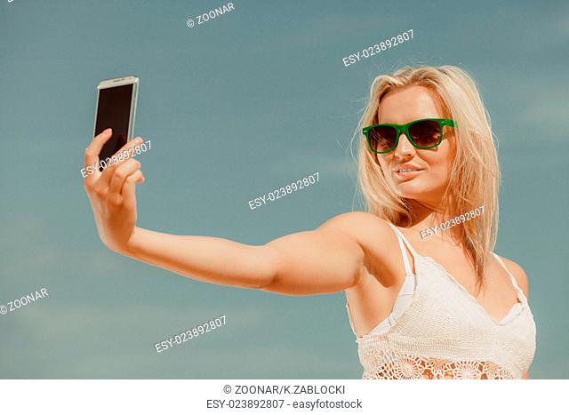 Girl with phone taking selfie