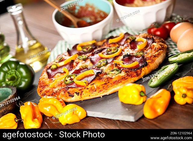 Delicious pizza served on wooden table