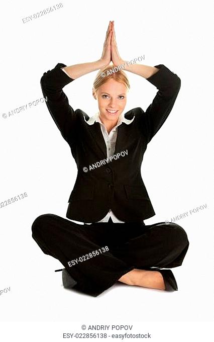 Businesswoman sitting in lotus flower position