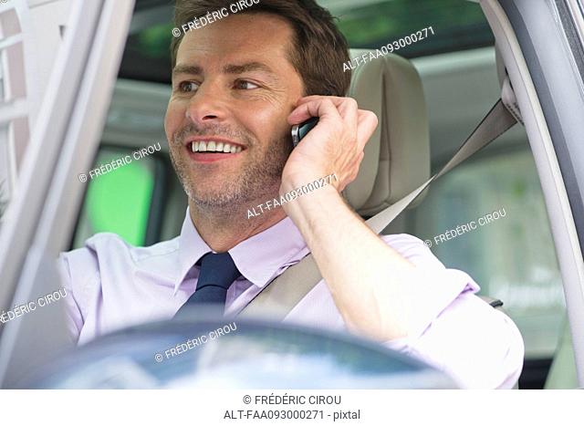 Man talking on cell phone while driving