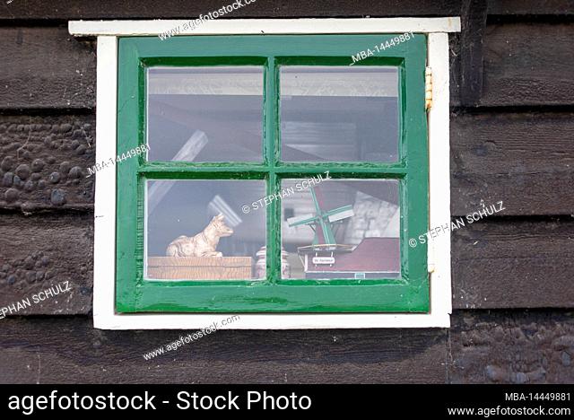 Miniature of a windmill, Dutch windmill, old wooden window, close-up, Zaanse Schans, Zaandam, Noord-Holland, Netherlands