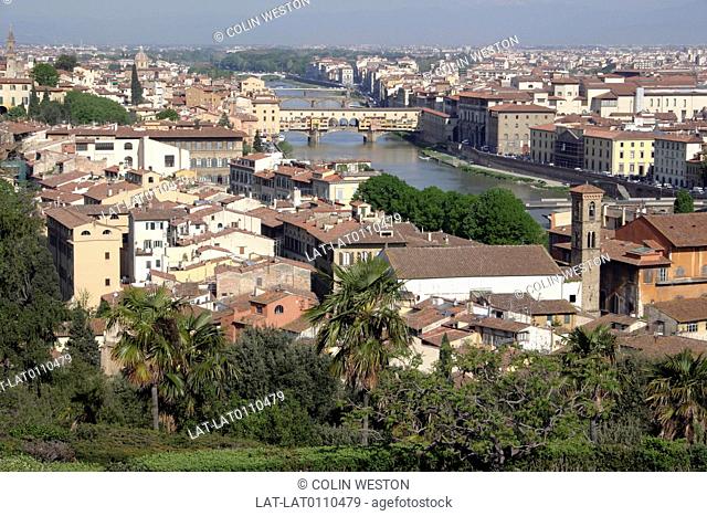 Cityscape. View over buildings to the River Arno and Ponte Vecchio. Bridge