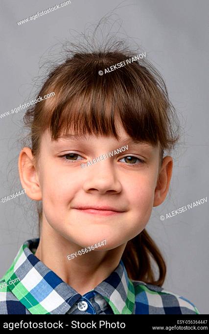Portrait of a self-confident ten-year-old girl of European appearance, close-up