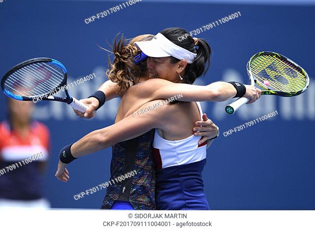 Martina Hingis, of Switzerland, left, and Chan Yung-Jan, of Taiwan, celebrate victory of the women's doubles after the U.S