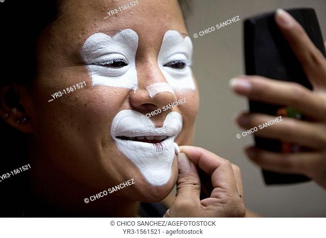 A female clown makes up in her hotel room during the 16th International Clown Convention: The Laughter Fair organized by the Latino Clown Brotherhood