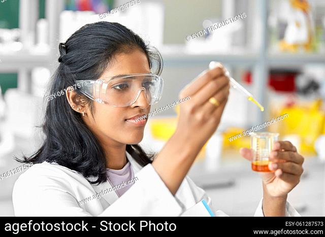scientist with chemical working in laboratory