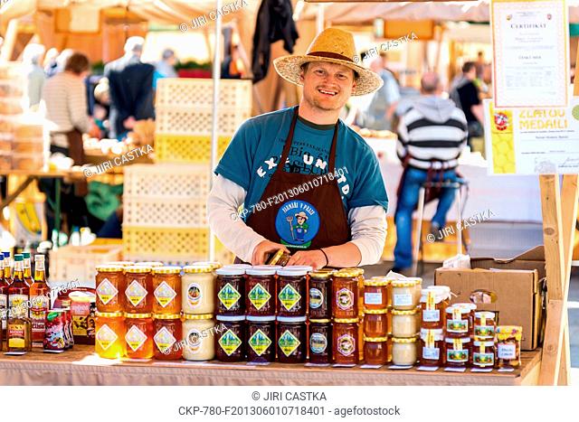 Farmer sells bee products such as honey at the market in Prague, Czech Republic on May 15, 2013. (CTK Photo/Jiri Castka)