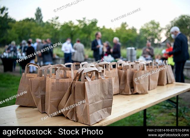 14 August 2021, North Rhine-Westphalia, Gladbeck: Bags with breakfast stand on a table. The new Ruhrtriennale has begun with a ""Concert at Dawn"" in the...