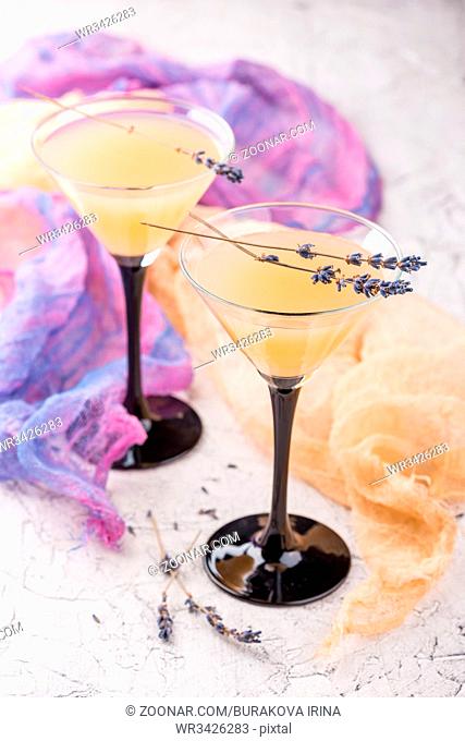Lemonade martini with lavender on white background