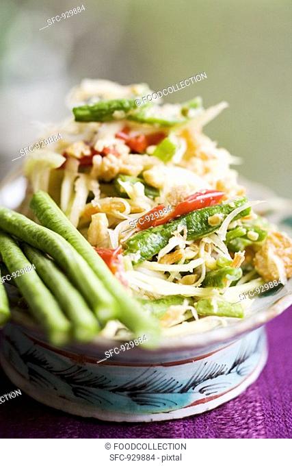 Papaya salad with snake beans and shrimps Thailand