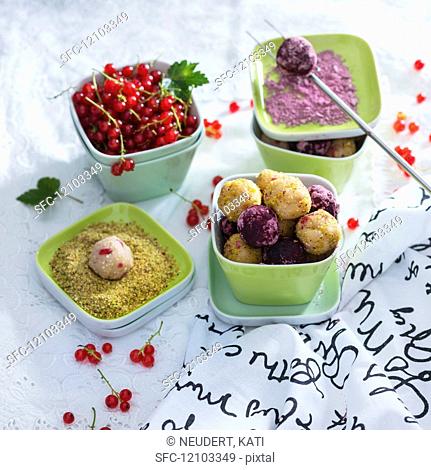 Vegan balls with quinoa and redcurrants in a pistachio and hibiscus coating