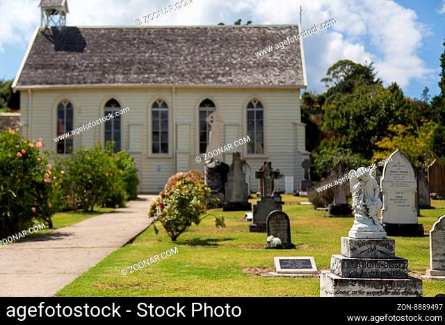 Russell, New Zealand - February 18, 2015: Small church and graveyard in the town of Russell