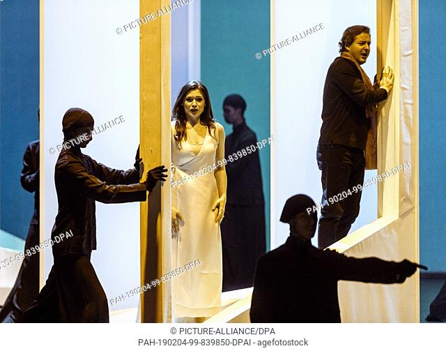30 January 2019, Hamburg: The singers Andriana Chuchman (M) as ""Eurydice"" and Dmitry Korchak (r) as ""Orphée"" play with extras on the photo rehearsal of...