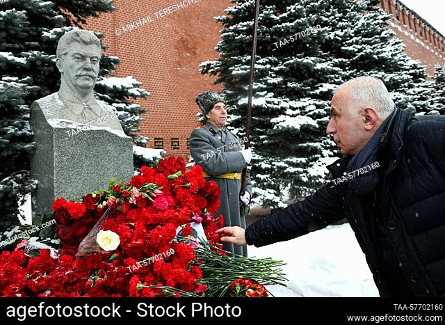 RUSSIA, MOSCOW - MARCH 5, 2023: Russian Communist Party members lay flowers at the grave of Soviet leader Joseph Stalin by the Kremlin Wall to mark the 70th...