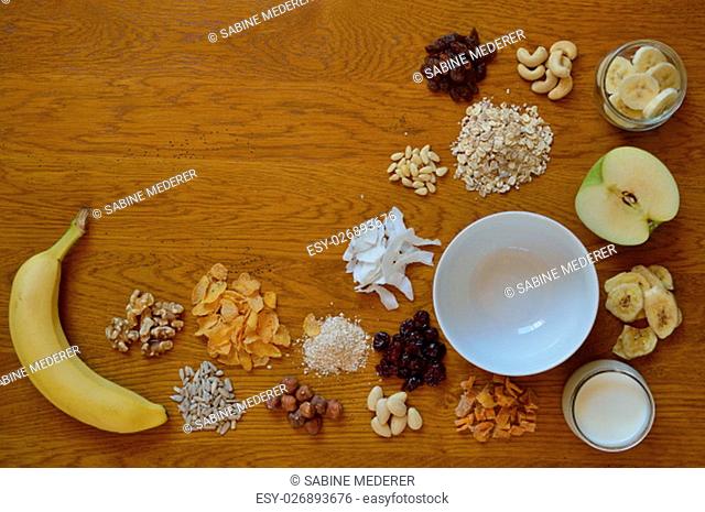 cereal bowl on the breakfast table with individual components of a cereal thereabout