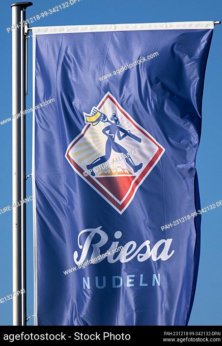 18 December 2023, Saxony, Riesa: A flag with the logo of Teigwaren GmbH flies in the wind in front of the factory. Photo: Robert Michael/dpa