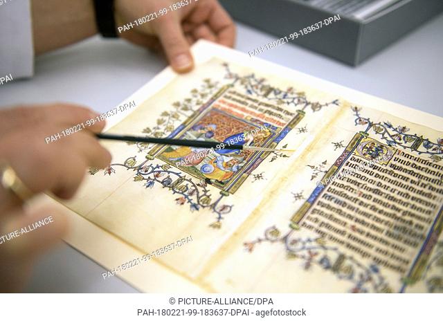 21 February 2018, Germany, Berlin: Restorer Katarzyna Schirmacher works on an original page of Mary of Guelders' prayer book