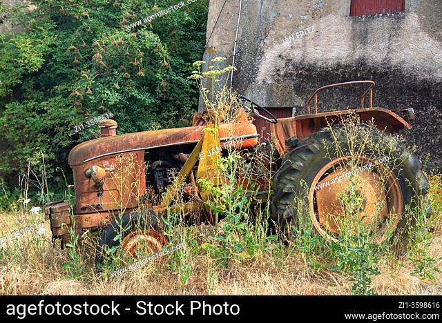 old red tractor at farm in Bourgogne, France