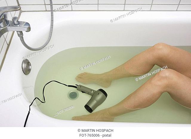 Hairdryer bath danger Stock Photos and Images | agefotostock