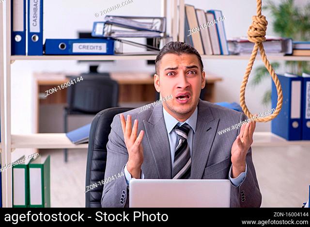 Young employee committing suicide at workplace