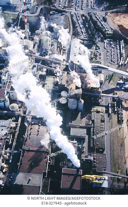 Canada, British Columbia, Campbell river. Aerial view of smoke coming from pulp mill on Vancouver island.
