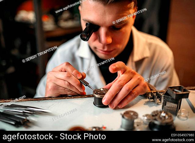 Clock maker repair old clockwork gear. Mechanical watches repairing
