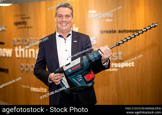 15 March 2021, Baden-Wuerttemberg, Leinfelden-Echterdingen: Henk Becker, chairman of the board of Bosch Power Tools, holds a GBH 18V-45C Professional hammer...