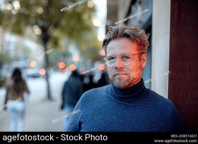 Man in turtleneck wearing eyeglasses