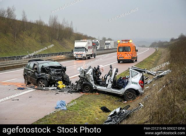 15 December 2023, Saxony-Anhalt, Querfurt: The cars involved in the serious accident with a wrong-way driver on the A38. Three people were killed in the...