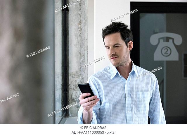 Man using smart phone