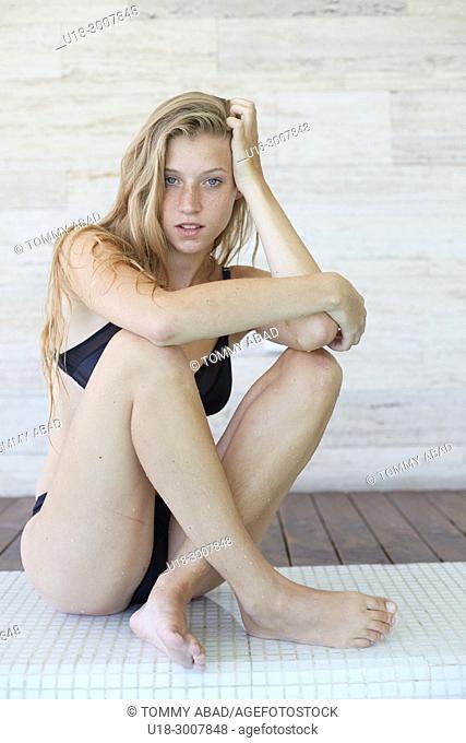 Blonde girl in black bikini, Stock Photo, Picture And Rights Managed Image.  Pic. U18-3007838