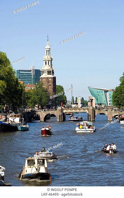 Montelbaanstoren, Watch Tower, NEMO Museum, Oude Schans, View over Oude Schans with leisure boats to Montelbaanstoren watch tower, and NEMO Museum, Amsterdam